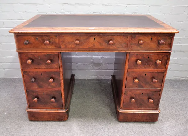 A Victorian walnut pedestal desk with nine drawers about the knee on plinth base, 108cm wide x 61cm deep x 74cm high.