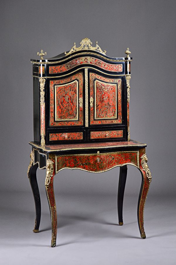 A late 19th century French boulle work gilt metal mounted ebonised bureau de dame, the super structure with pair of doors over drawers, the serpentine