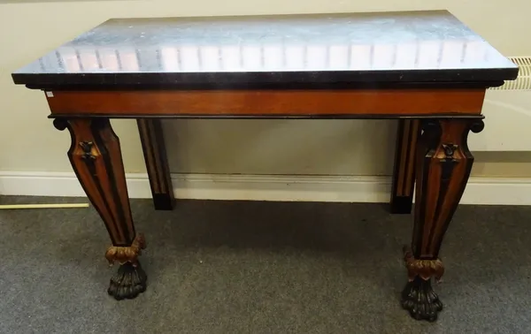 A Victorian console table, the rectangular black marble top on a part ebonised oak base, with tapering square supports, terminating in lion's paw feet