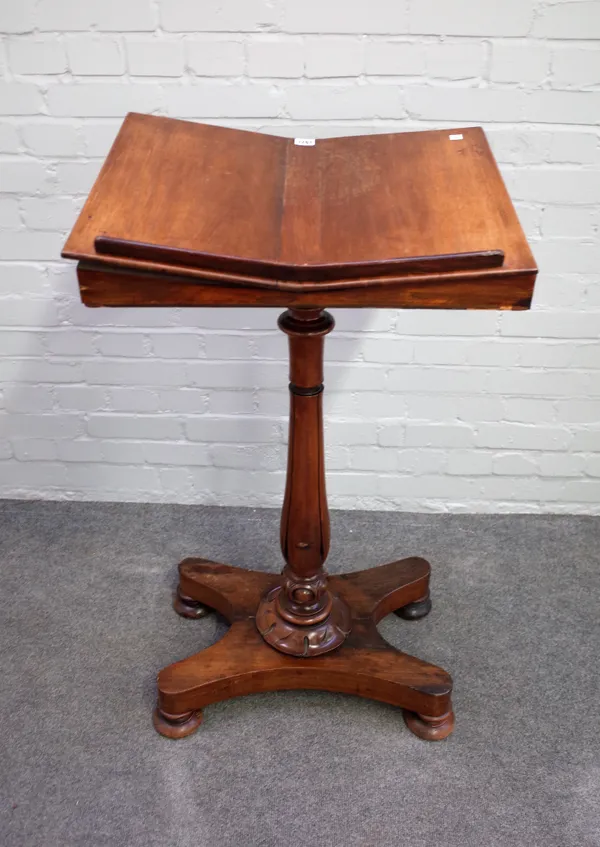 A William IV rosewood reading stand, the angle shaped top on lappet turned column and quatrefoil platform, 57cm wide x 105cm high.