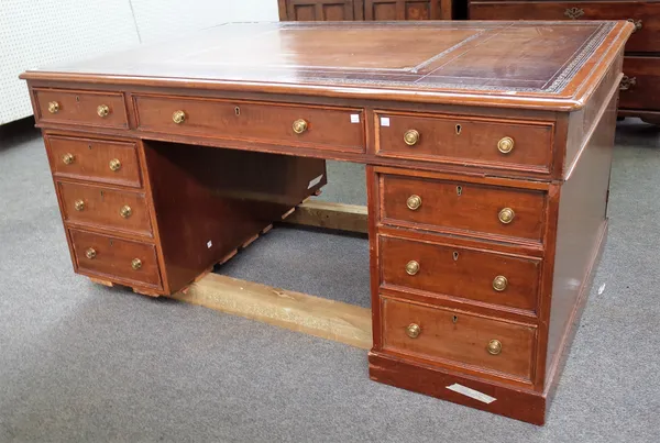 A 19th century mahogany partner's desk, with nine drawers about the knee and opposing pedestal cupboards, 153cm wide x 107cm deep x 73cm high.