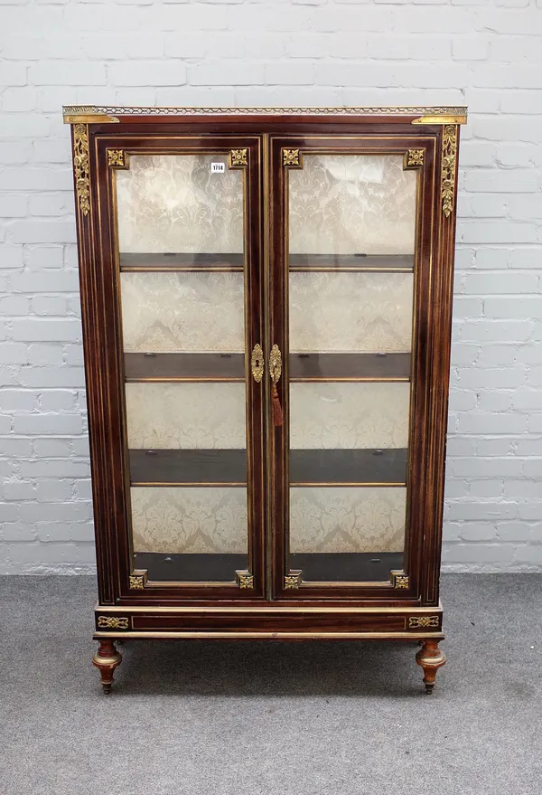 A 19th century French ormolu mounted mahogany vitrine, with pair of glazed doors on turned supports, 93cm wide x 154cm high x 32cm deep.
