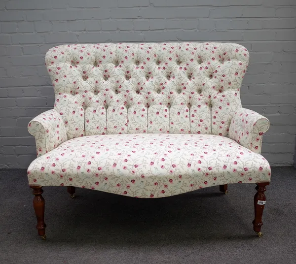 A Victorian style button back two seater sofa, on baluster turned supports, 124cm wide x 97cm high.