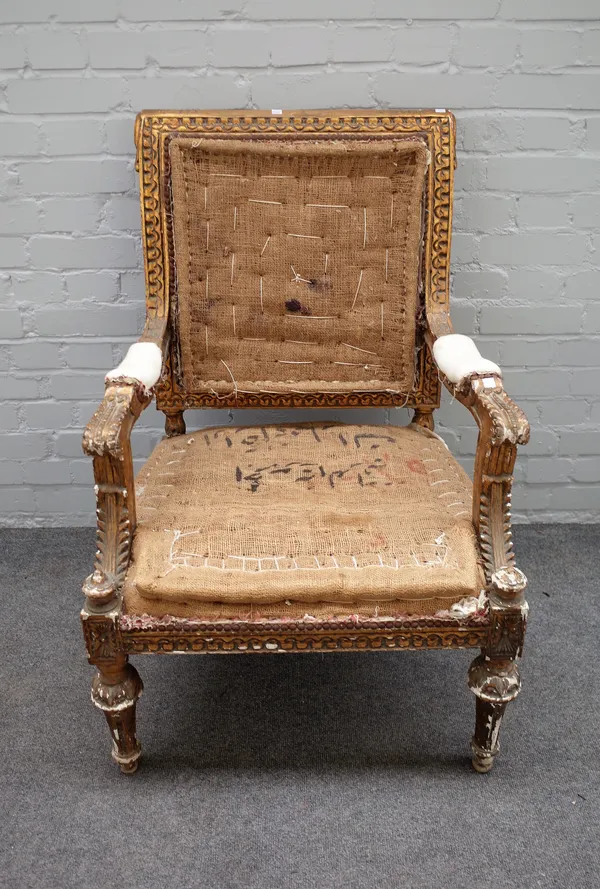 A Louis XVI style gilt framed open armchair on tapering turned supports, 66cm wide x 99cm high.