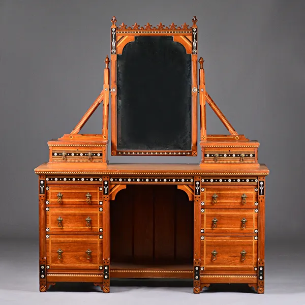 In the manner of Charles Bevan, a mid Victorian Gothic Revival ebony, ivory and purple wood inlaid walnut knee hole dressing table, 145cm wide x 173cm