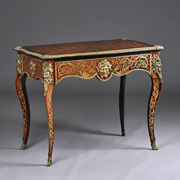 A 19th century French gilt metal mounted boulle work centre table, with secret sprung frieze drawer on cabriole supports, 90cm wide x 74cm high x 55cm