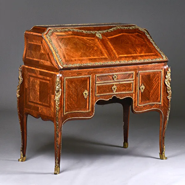 A 19th century ormolu mounted kingwood bureau, the caddy top with stepped and welled interior, with single frieze drawer flanked by cupboard, on shall