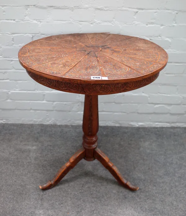 A 19th century Anglo-Indian hardwood circular tripod occasional table, with stellar veneered carved top, 62cm diameter x 72cm high.