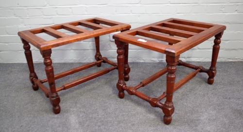 A pair of late 19th century walnut luggage stands with slatted tops and turned supports, united by double stretcher, 61cm wide x 42cm high x 41cm deep