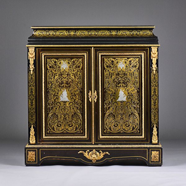 A Victorian brass and pewter inlaid gilt metal mounted ebonised side cabinet, the caddy top over pair of doors on shaped plinth base, 103cm wide x 109