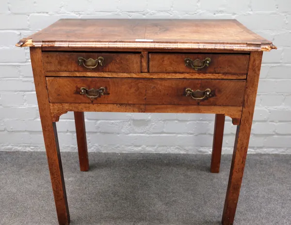 A mid-18th century walnut lowboy with two short and one long frieze drawer on block supports, 76cm wide x 74cm high x 46cm deep.