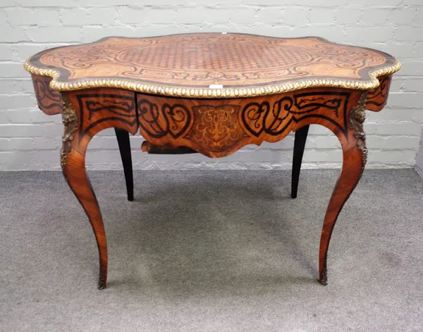 A mid-19th century French marquetry and parquetry inlaid gilt metal mounted centre table, the lozenge shaped top over single frieze drawer on cabriole