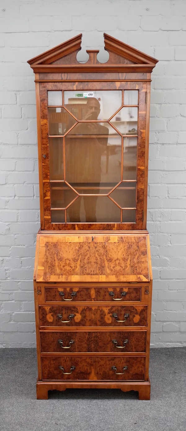Titchmarsh & Goodwin; a George II style burr yew bureau bookcase, the single astragal glazed door over fitted interior, four long graduated drawers an
