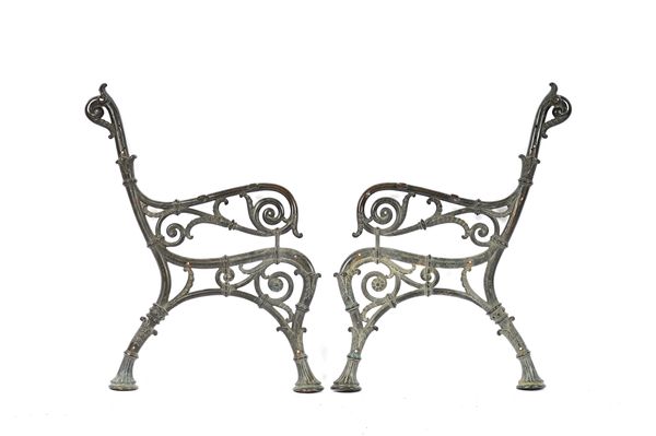 A pair of late 19th century cast bronze bench ends with pierced scroll decoration and cornucopia stile feet, 85cm high. Illustrated