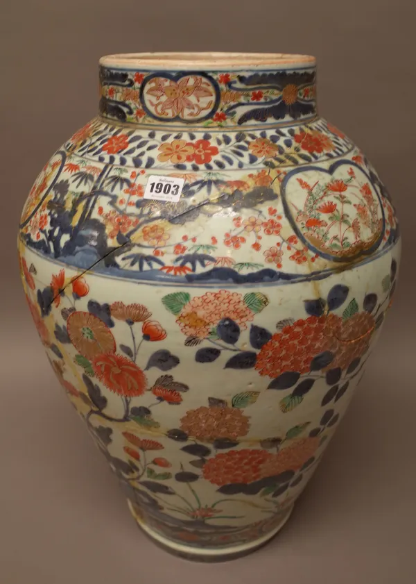 A large Japanese Imari vase, Edo period, circa 1700, painted with flowering shrubs and bamboo, (a.f), 59cm high.