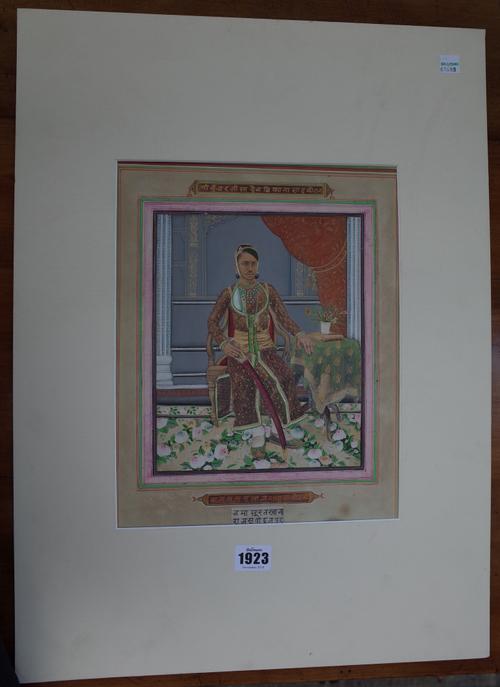 An Indian painting of a ruler, circa 1900, possibly painted over a printed base, depicting a young man seated in an interior beside a table, holding a
