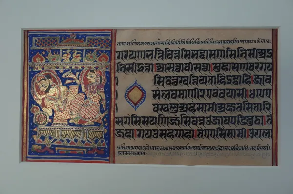 An Indian painting of a seated man and companion, opaque pigments on paper, 28cm. by 18cm; and a page of calligraphy with seated couple, (2).  4511