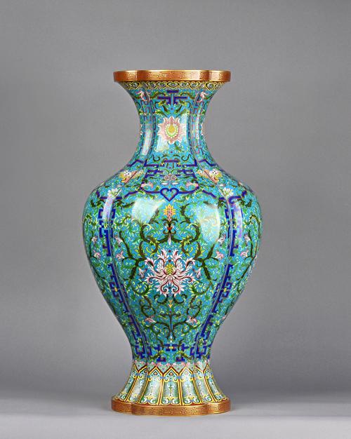 A large Chinese cloisonné baluster vase, 20th century, worked with flowers, bats and shou medallions against a turquoise ground between iron-red and g