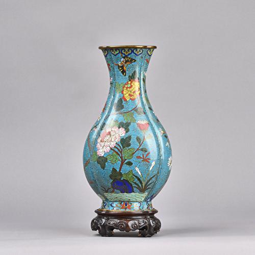 A Chinese cloisonné pear shaped vase, late 18th/19th century, of quatrelobed section, worked with insects amongst flowers against a turquoise ground,