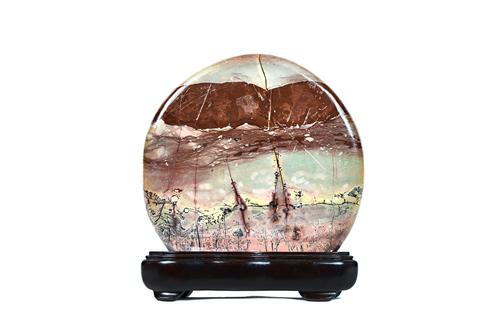 A group of twelve Chinese scholar's rocks, Qing dynasty and later, of various forms and colour, tallest 25cm. high, most with wood stands, (21). Prove