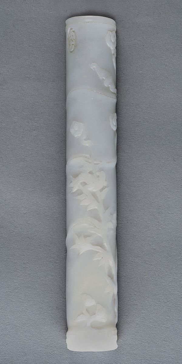 A Chinese white jade scroll weight, in the form of a section of bamboo, carved with a bat, bamboo and lingzhi beneath two characters, 19.5cm. length.