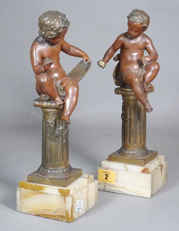 A pair of early 20th century spelter cherubs on columns, 30cm high, (a.f), (2). CAB