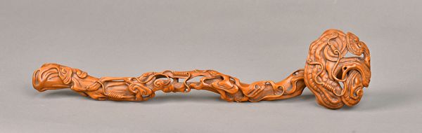 A Chinese boxwood ruyi sceptre, 19th/20th century, carved and pierced as a branch of lingzhi, the wood of warm tone, 42cm. length. Illustrated. Proven