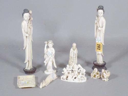 A group of mainly 19th century Asian ivory items including a Canton carved ivory puzzle, Japanese and Chinese figures and sundry.  CAB