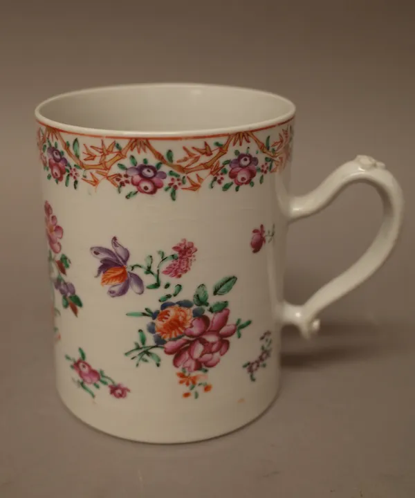 A Chinese export porcelain cylindrical mug, Qianlong, enamelled with groups of flowers beneath a flower and bamboo border, 12cm.high.