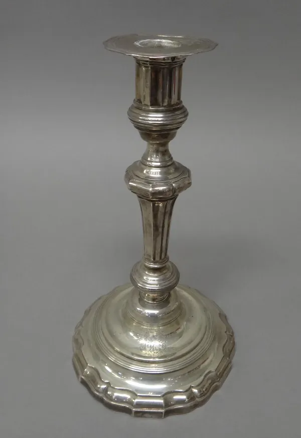 A French table candlestick, of 18th century style, armorial engraved, raised on a shaped circular base and having a detachable armorial engraved sconc