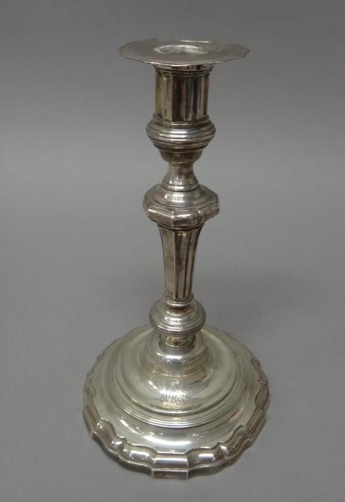 A French table candlestick, of 18th century style, armorial engraved, raised on a shaped circular base and having a detachable armorial engraved sconc