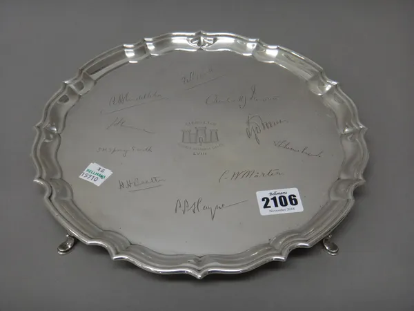 A silver salver of shaped circular form, the centre engraved with a military crest and with facsimile signatures, the history of the salver scratch en