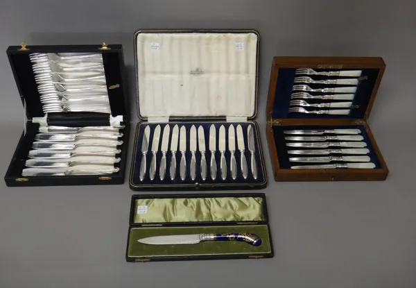 A set of six pairs of plated dessert or fruit knives and forks, with mother-of-pearl handles, with an oak case, a set of twelve tea knives, with plate