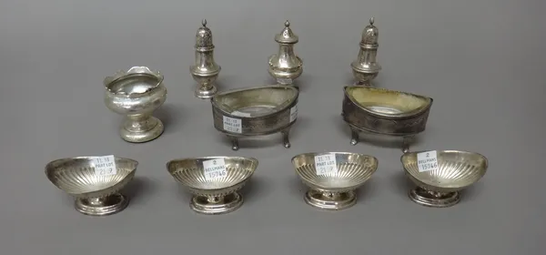 Silver, comprising; a pair of George III boat shaped salts, each raised on four fluted feet, London 1805, four similar Victorian boat shaped salts, wi