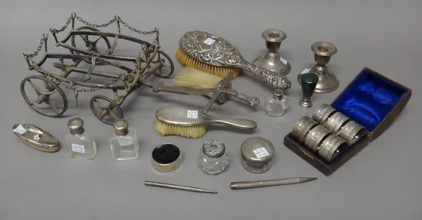 Silver and silver mounted wares, comprising; a pair of small scent bottles, a glass toilet jar, a small hairbrush, a hairbrush with embossed decoratio