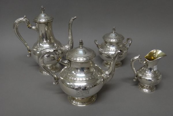 A French four piece tea and coffee set, comprising; a teapot, a coffee pot, a twin handled sugar bowl and cover and a milk jug, each piece of circular