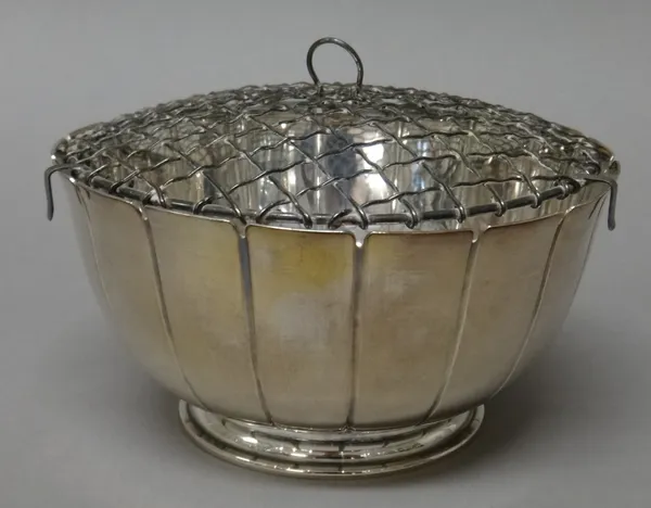 A silver rose bowl, of circular fluted form, raised on a circular foot, Sheffield 1964, diameter 16.5cm, weight 322 gms, with a detachable metal grill