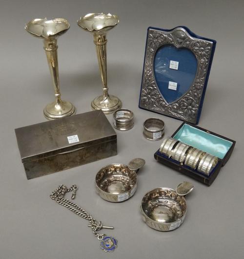 Silver and silver mounted wares, comprising; two similar bud vases, Birmingham 1915 and 1916, a shaped rectangular photograph frame, having a heart sh