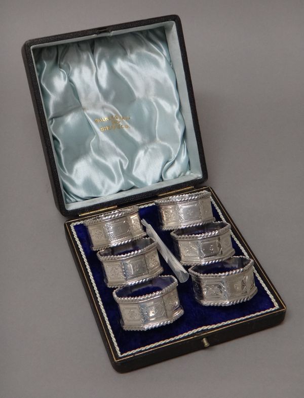 Six silver octagonal napkin rings, numbered one to six, each with engraved decoration within gadrooned rims, by Walker & Hall, Sheffield, four 1902 an