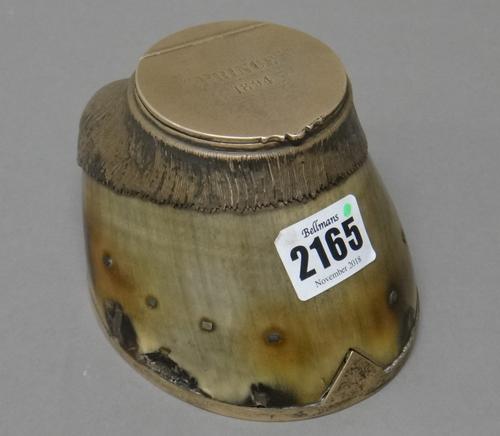 A Victorian silver mounted horse's hoof inkstand, the hinged lid detailed 'Prince' 1894, otherwise of a naturalistic form with a silver horseshoe fitt