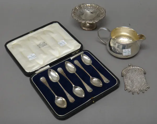 Silver, comprising; a set of six coffee spoons, Sheffield 1921, cased, a small pedestal bonbon dish, Birmingham 1902 and a milk jug, the marks rubbed,