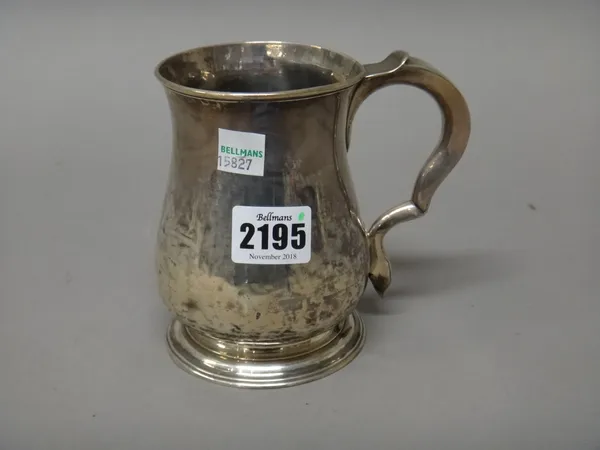 A George II silver mug, of baluster form, raised on a circular foot, the handle initial engraved, Newcastle 1750, maker William Dalton, height 12cm, w