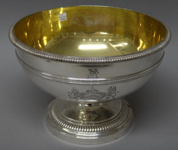 A George III silver rose bowl, of circular form, the rims with gadrooned decoration, the body engraved with a crest, a coat of arms and a motto, the b