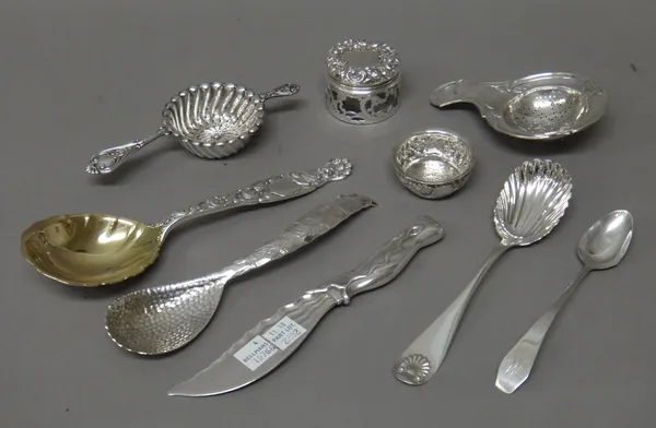 Sterling wares, comprising; three spoons of differing designs, a butter knife, combined gross weight 275 gms and a lidded glass toilet jar, a German t