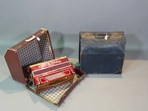 An early 20th century cased accordion and another, (2).    ROST