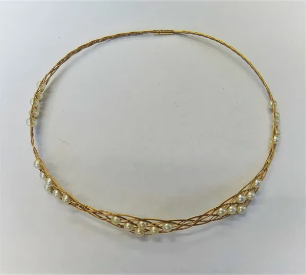 A gold and cultured pearl collar necklace, in an interwoven wirework design, spaced with groups of cultured pearls at intervals, detailed 14 K 585 to