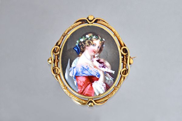 A Victorian gold mounted oval enamelled brooch, designed as the figure of a lady, her hair adorned with flowers, the mount decorated with a pierced sc