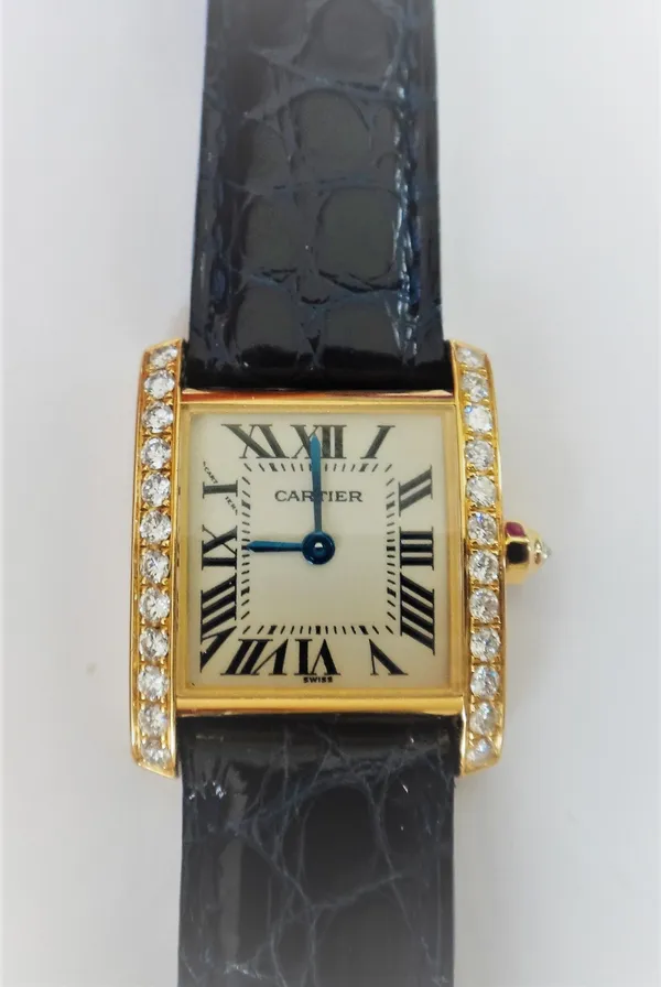 A Cartier gold and diamond set Tank Francaise lady's dress wristwatch, the signed cream coloured dial with black Roman numerals and with blued steel h