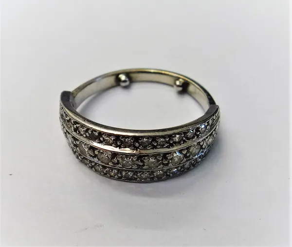 A diamond set half hoop ring, mounted with three rows of circular cut diamonds, ring size L, (note arthritic bobbles).