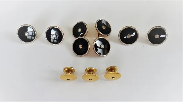 A gentleman's gold and platinum, diamond and black onyx set evening wear dress set, comprising; a pair of cufflinks, four buttons and three studs, eac